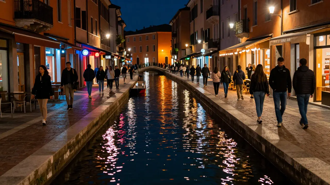 Night view of Navigli canals in Milan with lights reflecting on water and crowds.